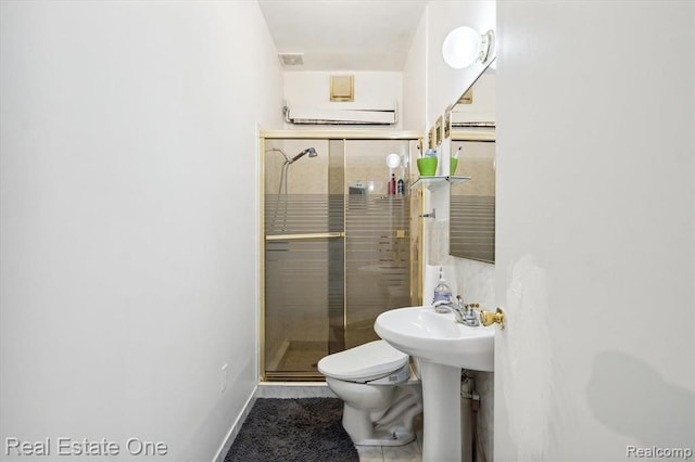 bathroom featuring toilet and walk in shower