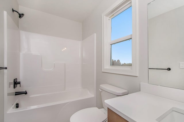 full bathroom featuring vanity, bathtub / shower combination, and toilet