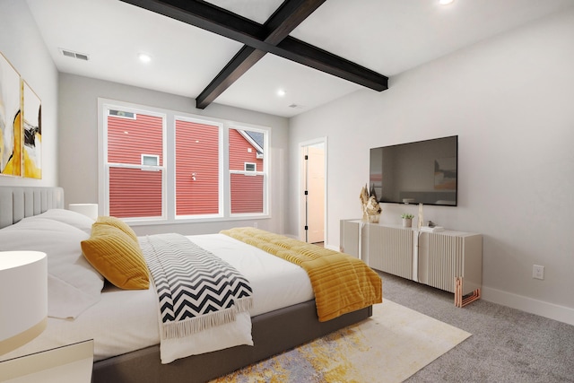 bedroom with radiator heating unit, beamed ceiling, and light colored carpet