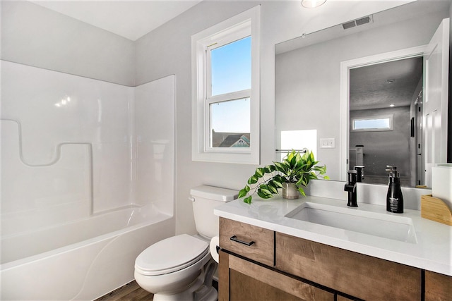 14236 Phoenix Pl, Holland, MI 49424 - bathroom with toilet, vanity, bathing tub / shower combination, and wood finished floors