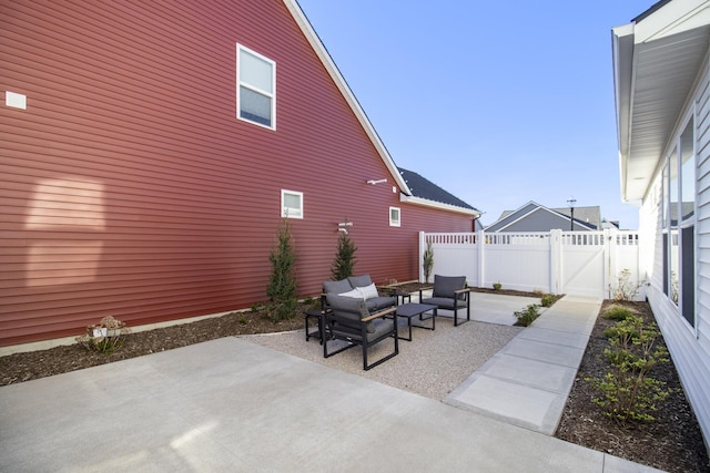 14236 Phoenix Pl, Holland, MI 49424 - view of patio / terrace featuring an outdoor living space, a fenced backyard, and a gate