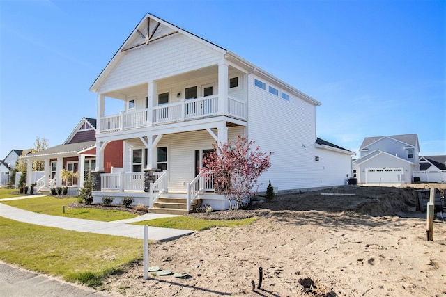 14236 Phoenix Pl, Holland, MI 49424 - view of front facade featuring a balcony, covered porch, and a garage