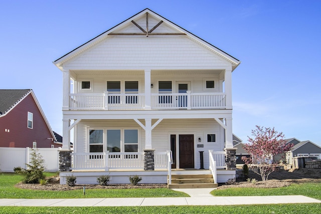 14236 Phoenix Pl, Holland, MI 49424 - view of front of house with a balcony, covered porch, and fence