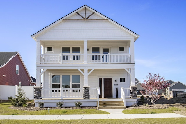 14236 Phoenix Pl, Holland, MI 49424 - view of front of house featuring a balcony, a porch, and fence