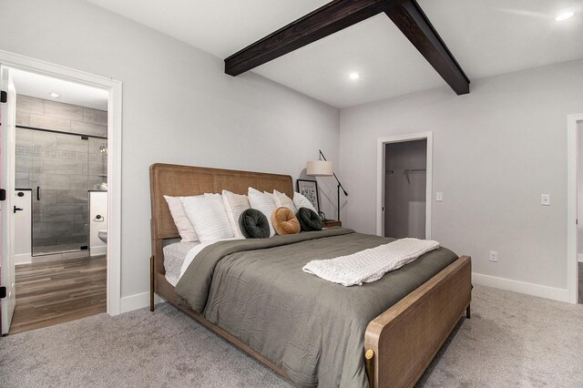 14236 Phoenix Pl, Holland, MI 49424 - bedroom featuring beamed ceiling, carpet, baseboards, recessed lighting, and ensuite bath