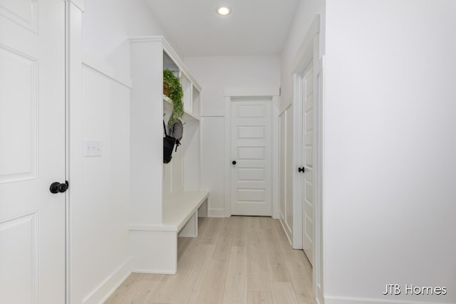 mudroom with light wood-type flooring and recessed lighting