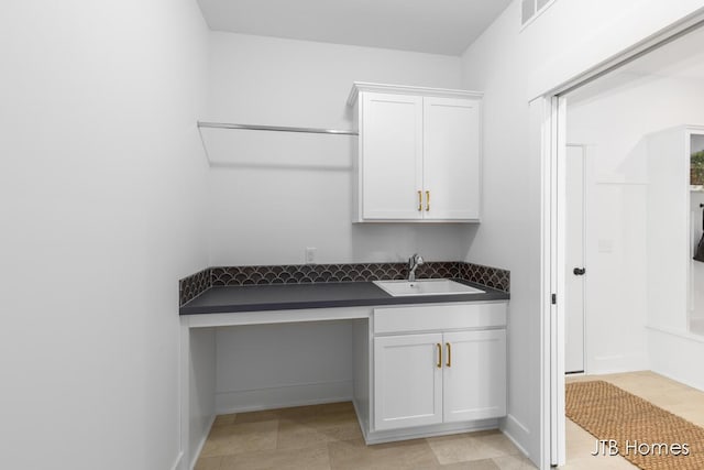 interior space with visible vents and a sink