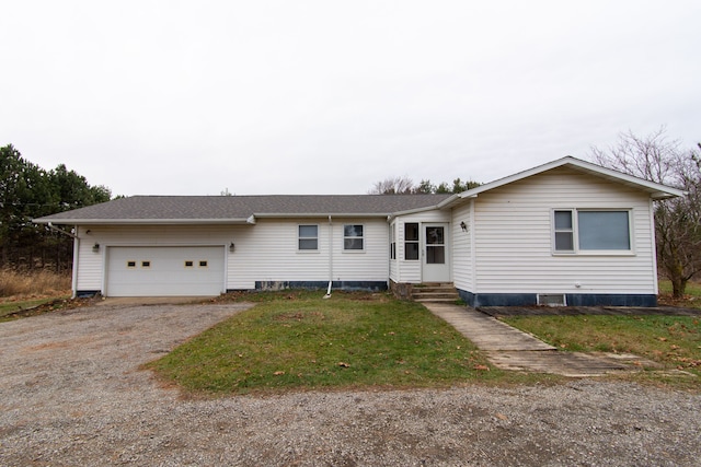 single story home with a front lawn and a garage