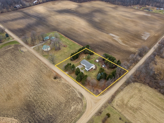 birds eye view of property with a rural view