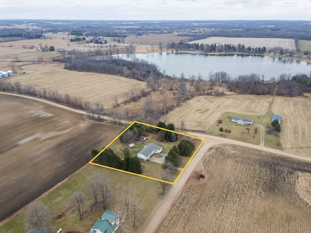 birds eye view of property featuring a rural view and a water view