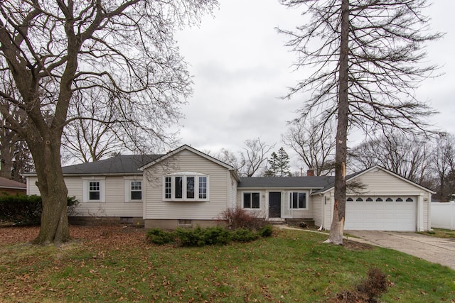 ranch-style home with a front yard and a garage