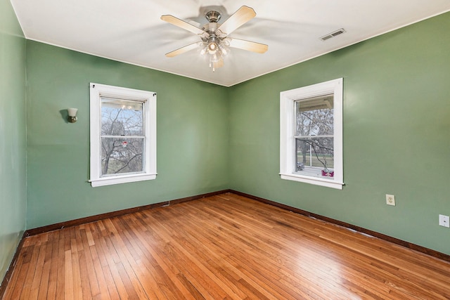 unfurnished room featuring light hardwood / wood-style flooring and ceiling fan