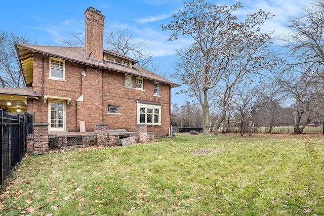 back of house with a yard