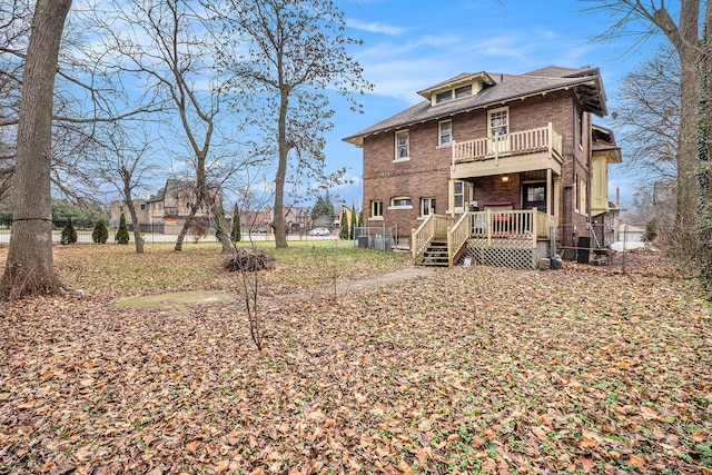 back of property featuring a balcony