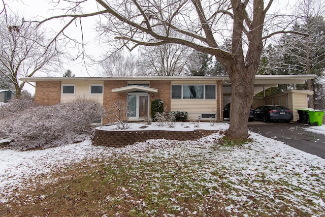 ranch-style house with a carport