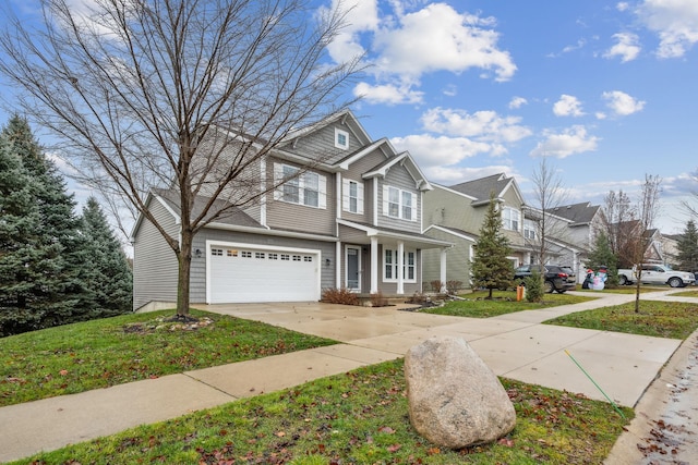 view of front of home featuring a front yard and a garage