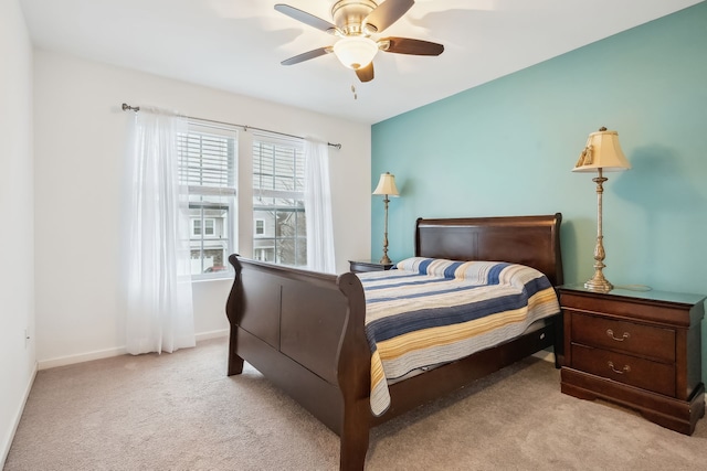 bedroom featuring ceiling fan and light colored carpet