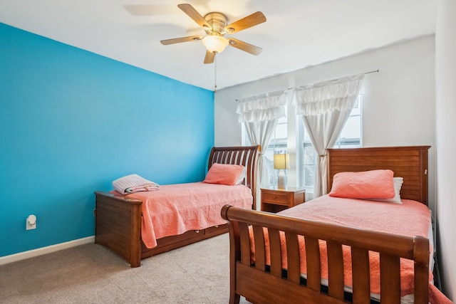 bedroom featuring ceiling fan and light carpet