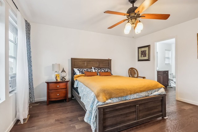 bedroom with ensuite bath, ceiling fan, dark hardwood / wood-style flooring, and cooling unit