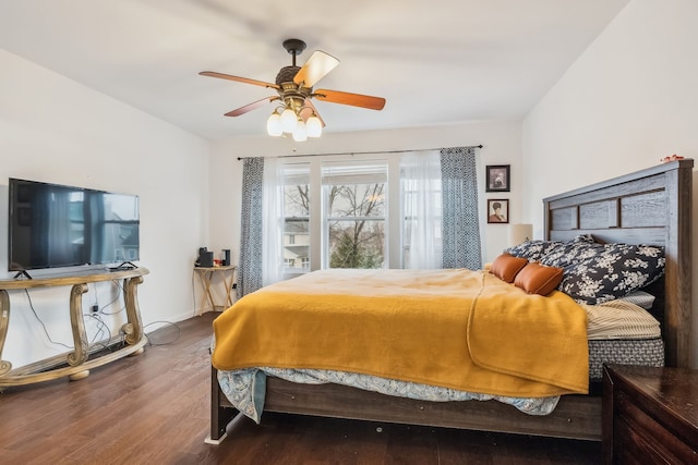 bedroom featuring ceiling fan and dark wood-type flooring