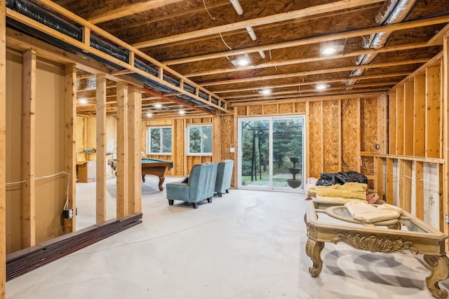 misc room with concrete flooring and billiards