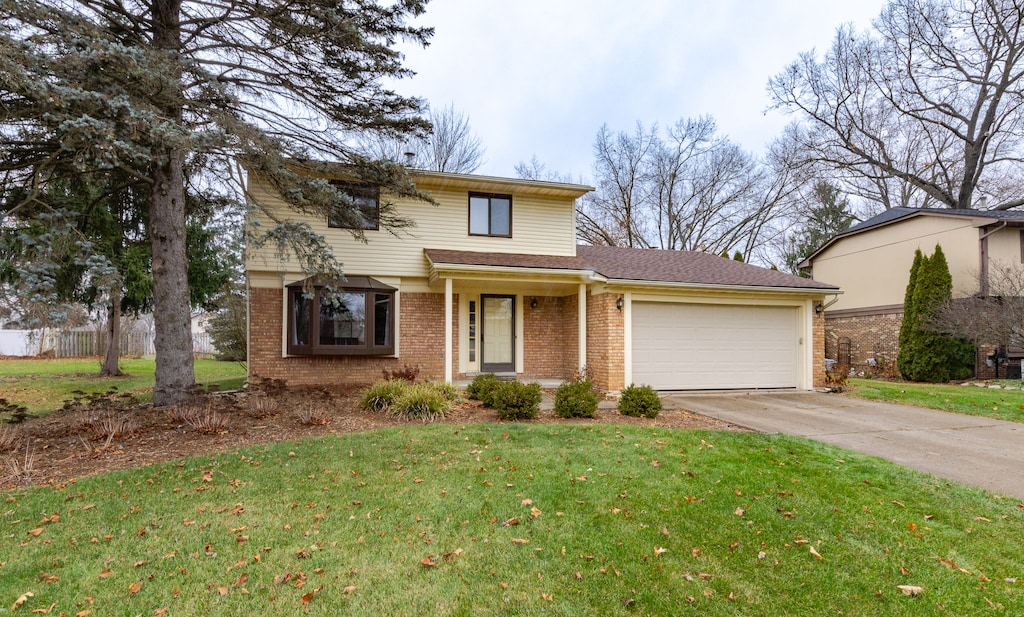 front of property featuring a garage and a front lawn