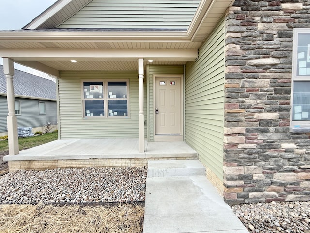 property entrance featuring covered porch