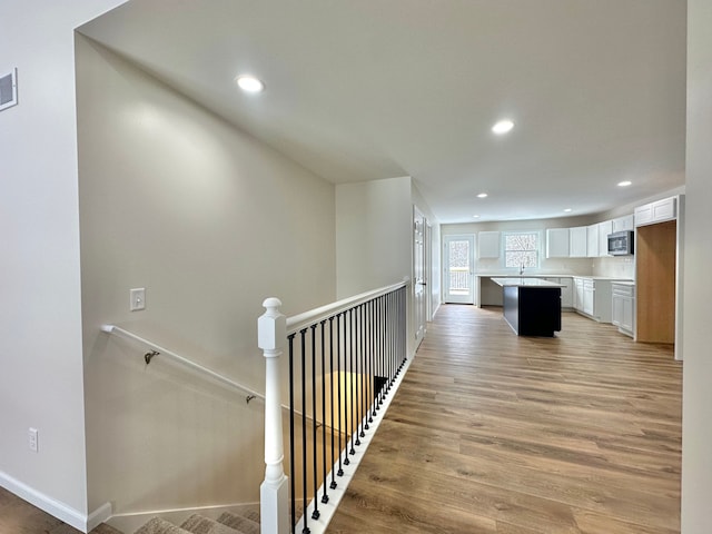 corridor featuring light hardwood / wood-style floors