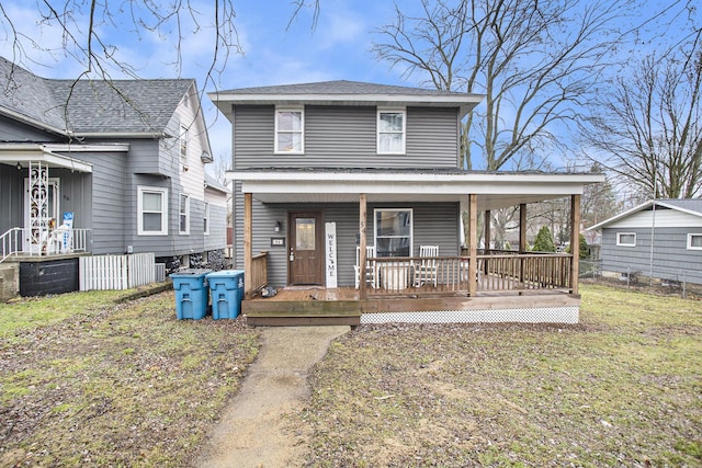 view of front of home featuring a porch and a front yard