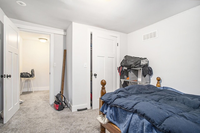 bedroom with light colored carpet