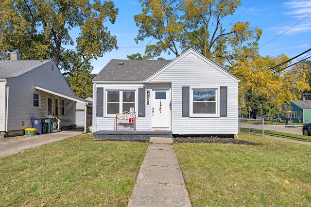 bungalow-style house featuring a front yard