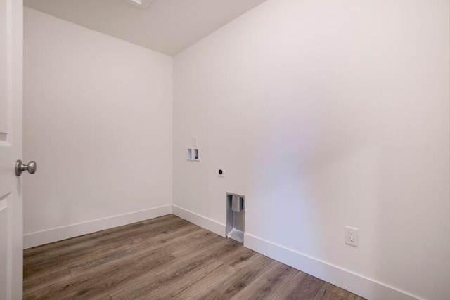 laundry area featuring hookup for a washing machine, baseboards, laundry area, electric dryer hookup, and light wood-type flooring