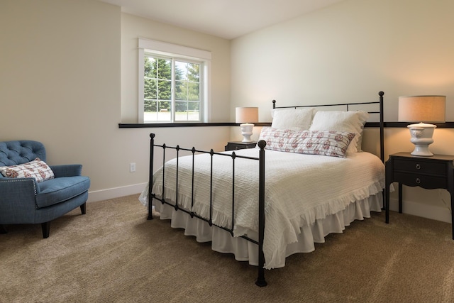 bedroom featuring carpet flooring and baseboards