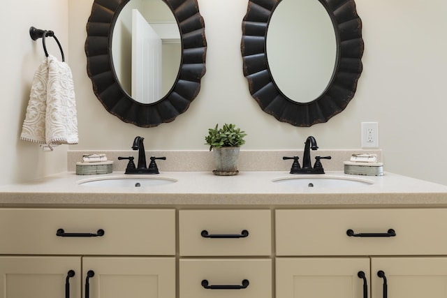 bathroom with double vanity and a sink