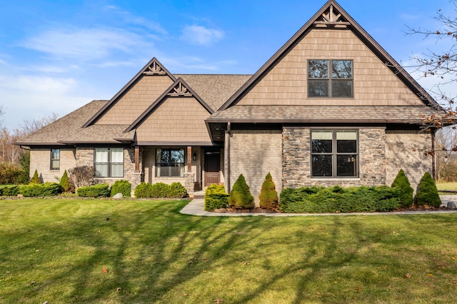 craftsman-style house with a front yard