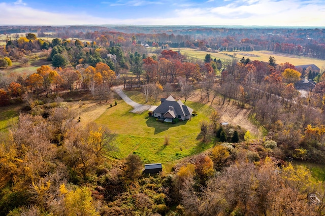 birds eye view of property with a rural view