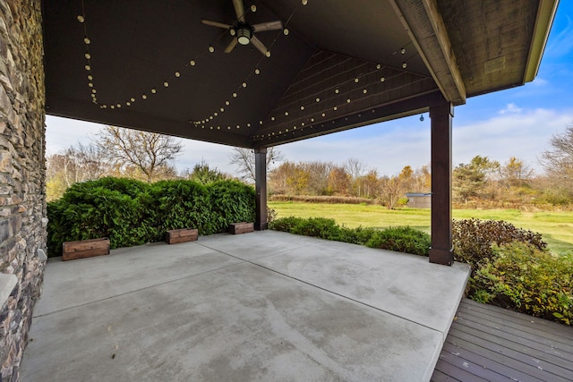 view of patio featuring ceiling fan and a wooden deck