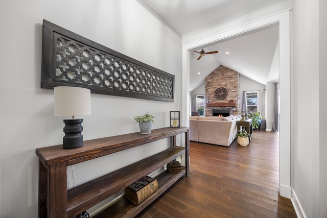 interior space with lofted ceiling and dark hardwood / wood-style flooring