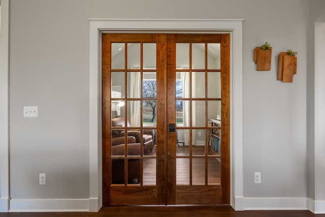 doorway to outside featuring hardwood / wood-style floors and french doors