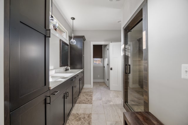 bathroom featuring vanity and a shower with shower door