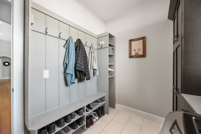 mudroom with light tile patterned floors