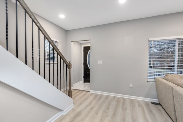 entrance foyer with light hardwood / wood-style floors