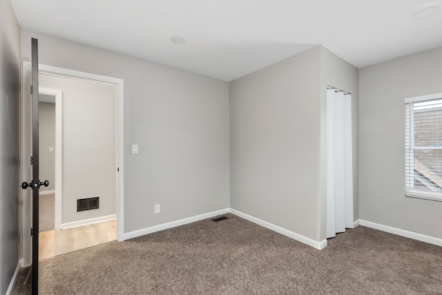 empty room featuring carpet floors