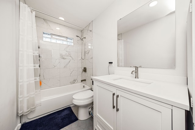 full bathroom featuring shower / bath combo with shower curtain, vanity, and toilet