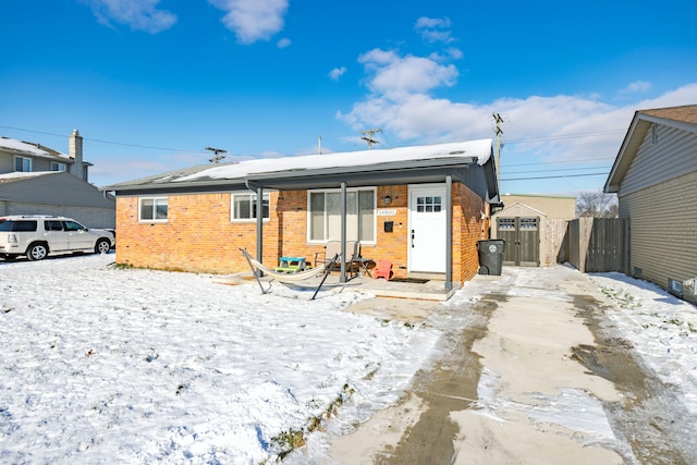 view of snow covered house