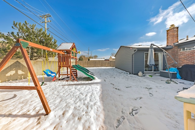 view of snow covered playground