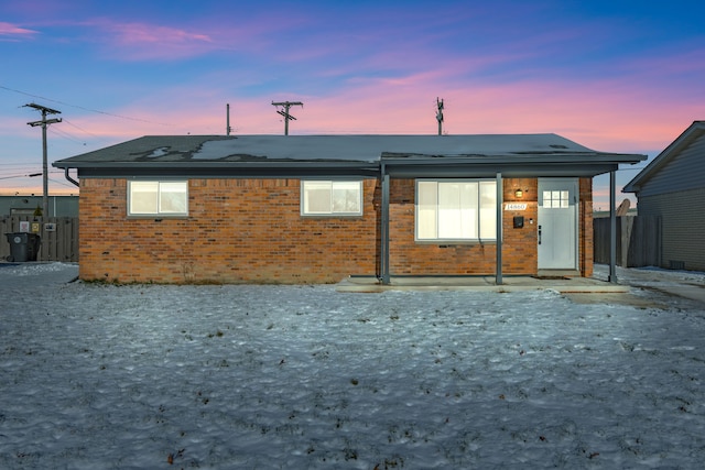 view of back house at dusk