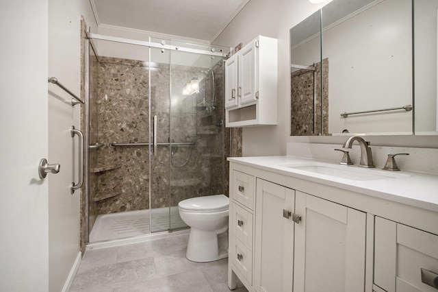 bathroom with vanity, toilet, a shower with door, and crown molding