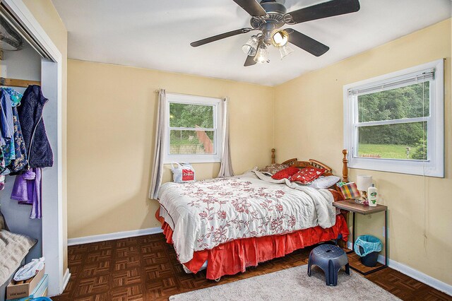 140 Wagon Wheel Ln, Battle Creek, MI 49017 - bedroom with multiple windows, a closet, and a ceiling fan
