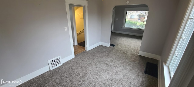 hallway featuring carpet flooring